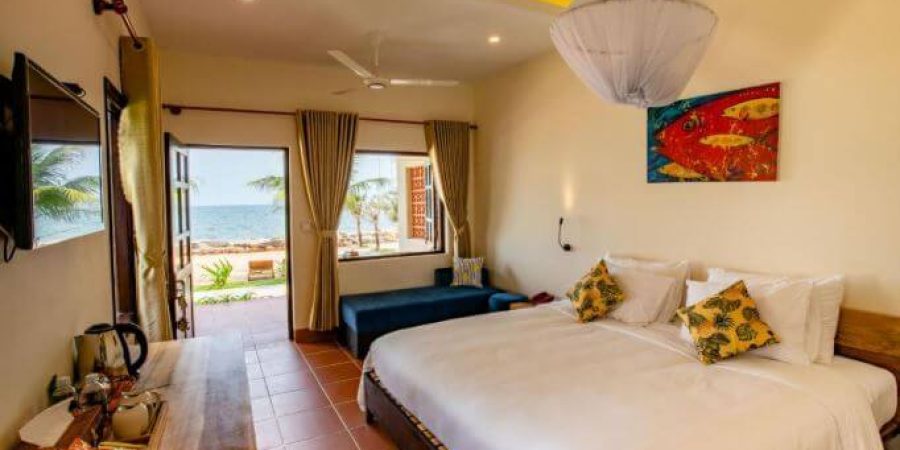 חדר שינה במלון Hula Hula Beachfront פו קוק