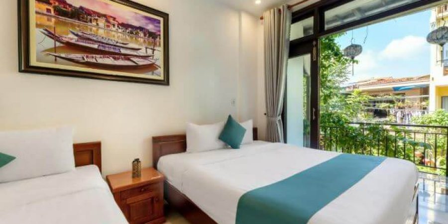 חדר שינה במלון Rockmouse Centre River Villa Hoi An